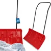 Two red snow shovels shown against a white background, with one shovel in snow. Produktbild-Vorschau