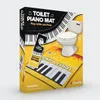 The image shows the packaging of a toilet piano mat, with a toilet and piano keys depicted on the box. Anteprima dell’immagine prodotto