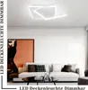 A modern living room with a sectional sofa, coffee table, and a large abstract painting on the wall. A contemporary LED ceiling light is illuminated overhead. Voir les images du produit