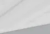 A close-up view of a white and gray textured surface, possibly a product or material. Voir les images du produit