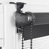 Close-up of a roller blind mechanism attached to a window frame. Produktbild-Vorschau