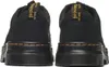The rear view of two black Dr. Martens shoes. Produktbild-Vorschau