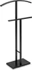 A black metal valet stand with a curved top hanger and a lower horizontal bar, shown against a white background. Podgląd zdjęcia produktu