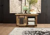 A rustic wooden chest with sliding doors and shelves, decorated with a globe, books, and a lamp. Produktbild-Vorschau