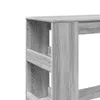 A close-up view of a gray wooden bar table with shelves. Produktbild-Vorschau