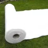 A roll of white fabric is laid out on a green grassy surface. Produktbild-Vorschau
