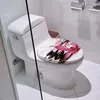 A toilet seat with a floral design in a bathroom. Produktbild-Vorschau
