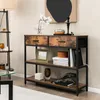 A console table with drawers and shelves, decorated with various items in a living room setting. Náhľad obrázku produktu