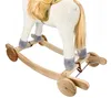 A close-up view of the lower body and rocking base of a plush rocking horse. Podgląd zdjęcia produktu