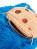 A close-up view of a blue plush toy with a cookie-shaped zipper pouch. Produktbild-Vorschau
