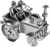 A metal figurine of a tractor with a driver and a dog. Anteprima dell’immagine prodotto