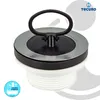 A close-up studio shot of a sink or bathtub drain stopper. Produktbild-Vorschau