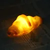 A close-up shot of a glowing croissant on a newspaper. Podgląd zdjęcia produktu