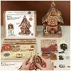 A ROKR 3D wooden puzzle of a cuckoo clock, with its packaging and unassembled parts laid out. Náhľad obrázku produktu
