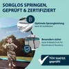 A young boy is jumping on a trampoline in a garden setting, with marketing text and icons highlighting product features. Produktbild-Vorschau