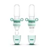 Two disassembled baby food feeders with interchangeable parts and storage cups. Anteprima dell’immagine prodotto