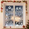 A window decorated with Christmas-themed window stickers. Produktbild-Vorschau