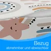 A close-up of a mattress cover with a rainbow and star pattern, showing a zipper. Produktbild-Vorschau
