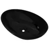 A black oval washbasin is shown from a slightly elevated side angle against a white background. Náhľad obrázku produktu