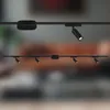 Two track lighting systems are shown against a blurred background. Anteprima dell’immagine prodotto