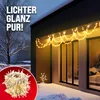 A house exterior decorated with warm white LED icicle lights during winter, with a close-up of the lights on a red background. Náhled obrázku produktu