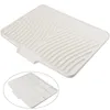 A white silicone dish drying mat with a textured surface and a small inset image showing the underside. Produktbild-Vorschau