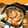 Chicken wings are being cooked in an air fryer with a silicone liner. Produktbild-Vorschau