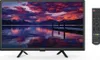A television set with a scenic image on its screen, placed on a stand, with a remote control next to it. Voir les images du produit