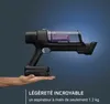 A hand holding a cordless vacuum cleaner against a gradient blue background. Voir les images du produit