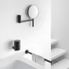A modern bathroom setting with black bathroom accessories mounted on a white wall. Voir les images du produit