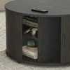A close-up view of a dark wood coffee table with open storage shelves. Náhled obrázku produktu