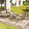 A patio set with chairs and a table on a deck, with a lawn and house in the background. Podgląd zdjęcia produktu