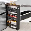 A narrow, multi-shelf rolling cart filled with kitchen items, placed next to a refrigerator. Produktbild-Vorschau