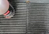 A close-up of a bottle of Ballistol Grill-Reiniger on a ribbed black surface. Produktbild-Vorschau