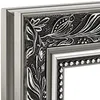 A close-up view of the corner of an ornate picture frame. Produktbild-Vorschau