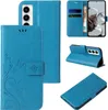 A collage of images showing a blue flip phone case with floral and butterfly designs from multiple angles. Produktbild-Vorschau