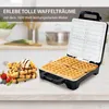 A waffle maker with waffles and toppings on a kitchen counter. Podgląd zdjęcia produktu