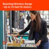 A woman is browsing books in an outdoor market. Produktbild-Vorschau