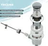 An exploded view of a sink drain assembly with descriptive text and a brand logo. Produktbild-Vorschau
