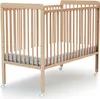 A wooden baby crib with a mattress on a white background. Anteprima dell’immagine prodotto