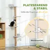 A cat tree is shown in a room with a cat on it. There is also a diagram illustrating how the cat tree is mounted to the wall. Náhled obrázku produktu