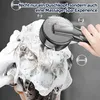 A hand holding a shower head over a person's soapy hair. Produktbild-Vorschau