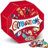 A red hexagonal box of Celebrations chocolates with various chocolates depicted on the lid and some loose chocolates in the foreground. Produktbild-Vorschau