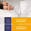 A woman is lying in bed, smiling and holding her hand to her forehead. The bottom part of the image contains marketing information with icons and text. Produktbild-Vorschau