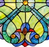 A close-up view of a stained glass suncatcher with intricate patterns and vibrant colors. Produktbild-Vorschau