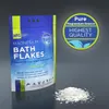 A product package of magnesium bath flakes with a pile of flakes in front of it, and a circular marketing graphic to the right. Náhľad obrázku produktu
