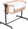 A baby crib with a beige frame and white mattress, on a white background. Náhled obrázku produktu
