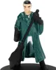A miniature figure of a person in a green robe holding a broom. Produktbild-Vorschau