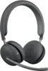 A pair of dark gray wireless headphones with a microphone boom, shown from a diagonal angle against a white background. Voir les images du produit