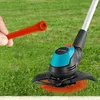 A hand holding an orange plastic blade is shown next to a grass trimmer on a lawn. Produktbild-Vorschau
